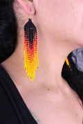 "Nine strands" earrings, approx. 10.5 cm x 2.5 cm, entirely handmade from colored beads (black, red, orange, and yellow)